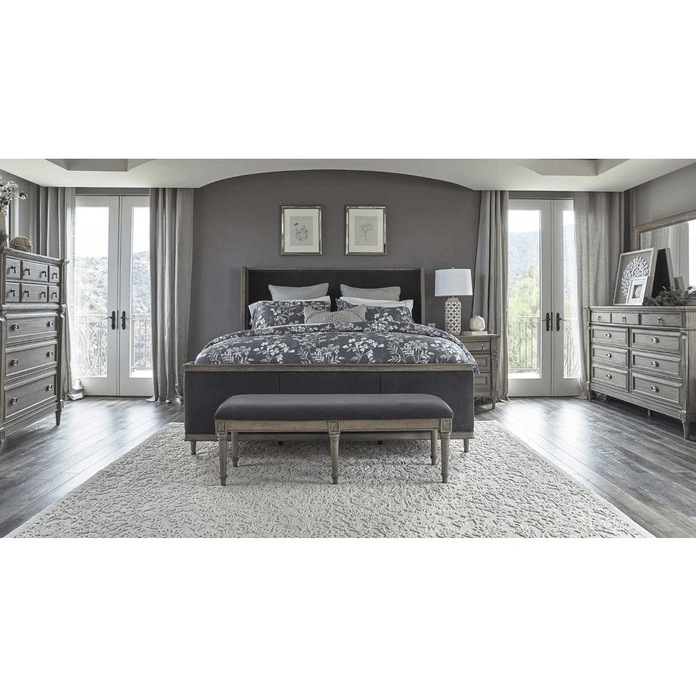 Alderwood 5-piece Eastern King Bedroom Set in French Grey featuring bed, nightstand, dresser, mirror, and chest in a stylish room.