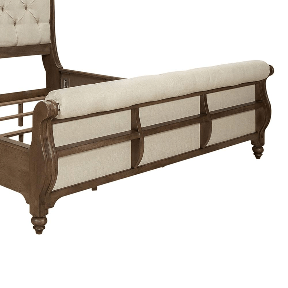 Americana Farmhouse queen sleigh bed footboard with button tufted upholstered linen and nail head accents in dusty taupe finish.