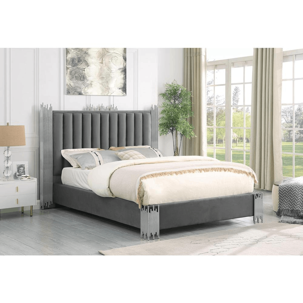 Eastern King size dark grey velvet platform bed with silver corners in a modern bedroom.
