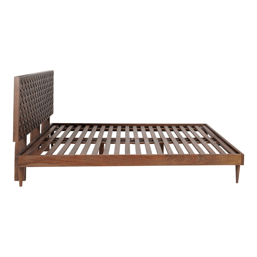 Solid Sheesham wood Pablo King Bed with dark walnut finish and intricately designed carved headboard.